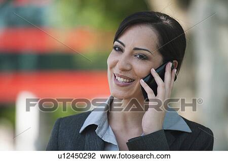 Young woman on smartphone View Large Photo Image Stock Image - Young woman on smartphone. Fotosearch