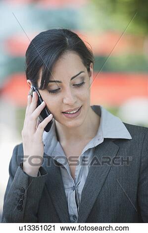 Young woman on smartphone View Large Photo Image Stock Image - Young woman on smartphone. Fotosearch