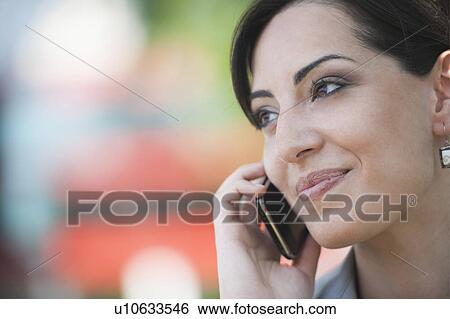 Young woman on smartphone View Large Photo Image Stock Photograph - Young woman on smartphone. Fotosearch