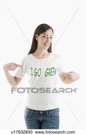 Young woman wearing 'I go green' tshirt View Large Photo Image Stock Image - Young woman wearing 'I go green' tshirt. Fotosearch