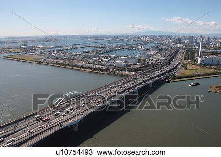 Stock Image - Aerial view of bridge over Tokyo bay, Edogawa ward, Tokyo Prefecture, Honshu, Japan. Fotosearch