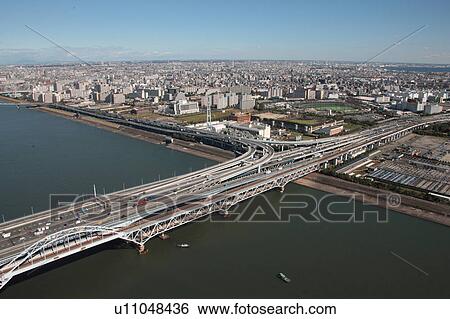 Stock Photograph - Aerial view of bridge over Tokyo bay, Edogawa ward, Tokyo Prefecture, Honshu, Japan. Fotosearch