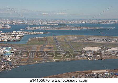 Stock Image - Aerial view of Haneda airport, Shinagawa ward, Tokyo Prefecture, Honshu, Japan. Fotosearch