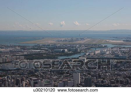 Stock Image - Aerial view of Haneda airport, Shinagawa ward, Tokyo Prefecture, Honshu, Japan. Fotosearch