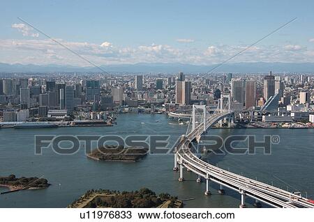 Stock Image - Aerial view of Rainbow bridge, Minato ward, Tokyo Prefecture, Honshu, Japan. Fotosearch