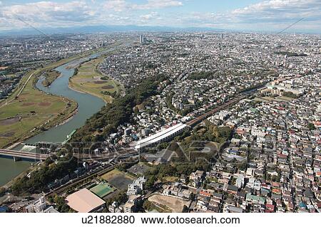 Stock Image - Aerial view of Tamagawa river, Ohta ward, Tokyo Prefecture, Honshu, Japan. Fotosearch