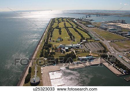 Stock Image - Aerial view of Tokyo Bay and Wakasu golf course, Koto ward, Tokyo Prefecture, Honshu, Japan. Fotosearch