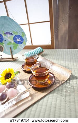 Barley tea and sweet food on tatami mat View Large Photo Image Picture - Barley tea and sweet food on tatami mat. Fotosearch
