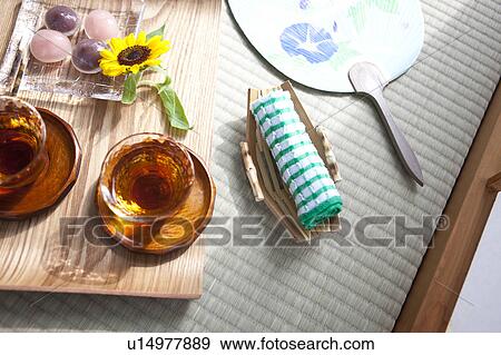 Barley tea and sweet food on tatami mat View Large Photo Image Stock Photo - Barley tea and sweet food on tatami mat. Fotosearch