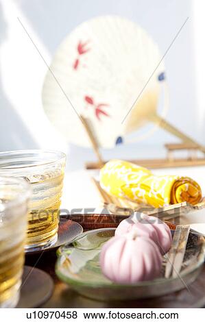 Barley tea, sweet food and fan View Large Photo Image Stock Photo - Barley tea, sweet food and fan. Fotosearch