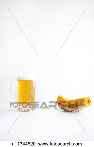 Stock Image - Beer and wet towel. Fotosearch