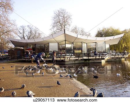 Stock Image - Birds Being Fed at Serpentine Lake. Fotosearch