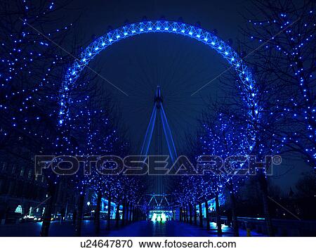 Stock Image - Blue Illuminated London Eye. Fotosearch