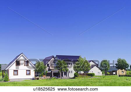 Stock Photography - Blue Sky Over Houses. Fotosearch