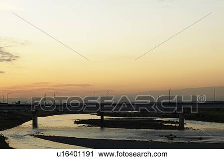 Bridge over river at dusk, Tokyo Prefecture, Honshu, Japan View Large Photo Image Stock Image - Bridge over river at dusk, Tokyo Prefecture, Honshu, Japan. Fotosearch