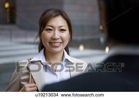 Picture - Business Colleagues Meeting Outside. Fotosearch