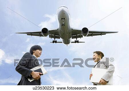 Businesspeople Meeting Below Airplane View Large Photo Image Stock Image - Businesspeople Meeting Below Airplane. Fotosearch