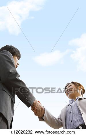 Stock Image - Businesspeople Shaking Hands. Fotosearch