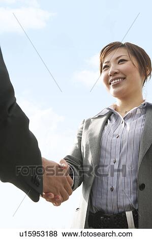 Stock Photo - Businesspeople Shaking Hands. Fotosearch
