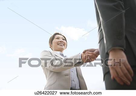 Stock Photo - Businesspeople Shaking Hands. Fotosearch
