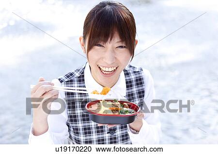Businesswoman eating lunch View Large Photo Image Stock Image - Businesswoman eating lunch. Fotosearch