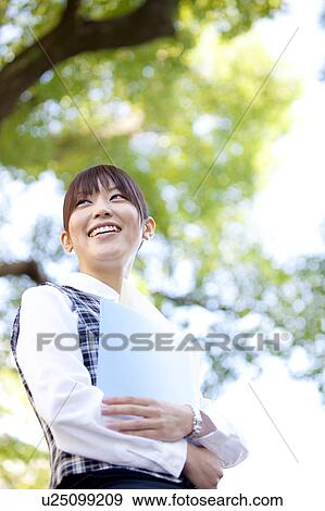 Businesswoman holding files View Large Photo Image Stock Photo - Businesswoman holding files. Fotosearch