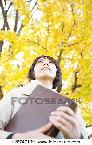 Businesswoman looking up View Large Photo Image Stock Photo - Businesswoman looking up. Fotosearch