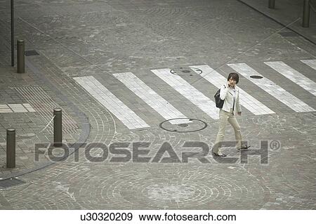 Businesswoman on cell phone, High Angle View View Large Photo Image Stock Photo - Businesswoman on cell phone, High Angle View. Fotosearch