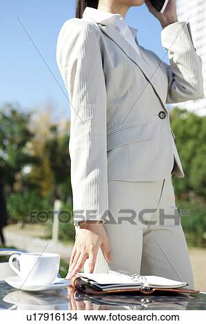 Businesswoman on cell phone View Large Photo Image Picture - Businesswoman on cell phone. Fotosearch