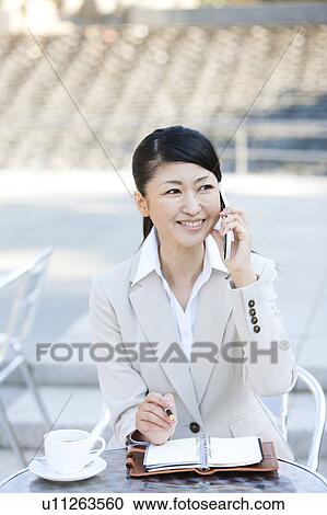 Businesswoman on cell phone View Large Photo Image Stock Image - Businesswoman on cell phone. Fotosearch