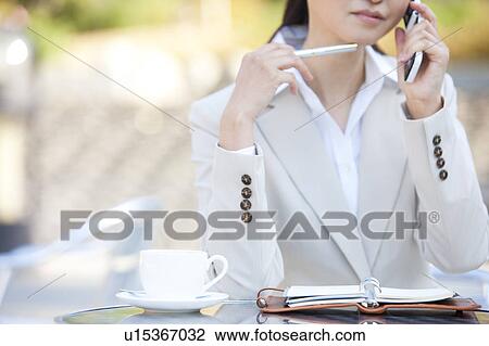 Businesswoman on cell phone View Large Photo Image Stock Image - Businesswoman on cell phone. Fotosearch