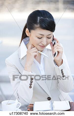 Businesswoman on cell phone View Large Photo Image Stock Image - Businesswoman on cell phone. Fotosearch