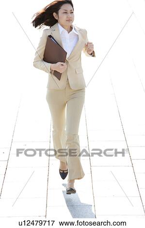 Businesswoman running View Large Photo Image Stock Photo - Businesswoman running. Fotosearch
