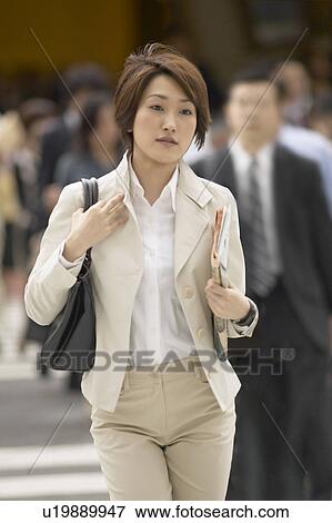 Stock Photo - Businesswoman walking. Fotosearch
