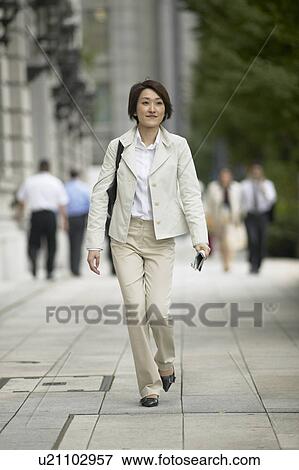 Businesswoman walking View Large Photo Image Stock Photo - Businesswoman walking. Fotosearch