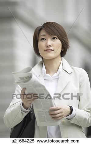 Businesswoman with newspaper View Large Photo Image Stock Photography - Businesswoman with newspaper. Fotosearch