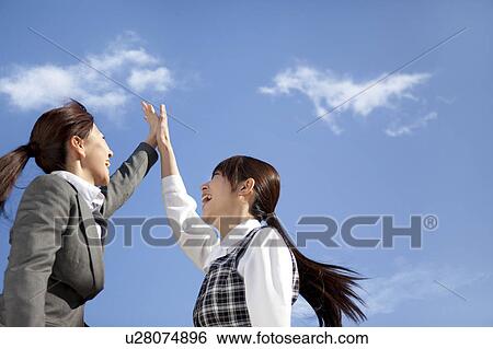Businesswomen high fiving View Large Photo Image Stock Photograph - Businesswomen high fiving. Fotosearch