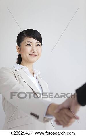 Businesswomen shaking hands View Large Photo Image Stock Photo - Businesswomen shaking hands. Fotosearch