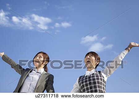 Stock Photo - Businesswomen waving hands. Fotosearch