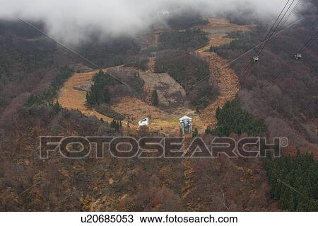 Stock Image - Cable Car in Mountains. Fotosearch
