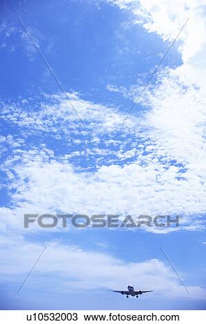 Stock Image - Commercial airplane flying, Japan. Fotosearch