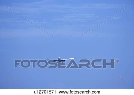 Stock Image - Commercial airplane flying, Japan. Fotosearch
