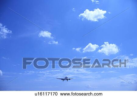 Stock Image - Commercial airplane flying, Japan. Fotosearch