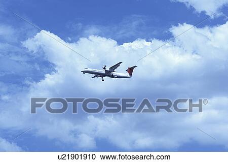 Stock Image - Commercial airplane flying, Japan. Fotosearch