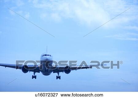 Stock Photo - Commercial airplane flying, Japan. Fotosearch