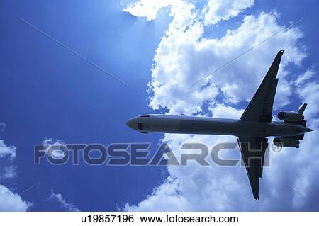 Stock Photograph - Commercial airplane flying, Japan. Fotosearch