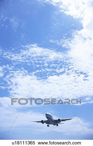 Stock Photography - Commercial airplane flying, Japan. Fotosearch