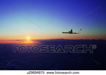 Corporate jet flying in the sky, digital composite View Large Photo Image Stock Photography - Corporate jet flying in the sky, digital composite. Fotosearch