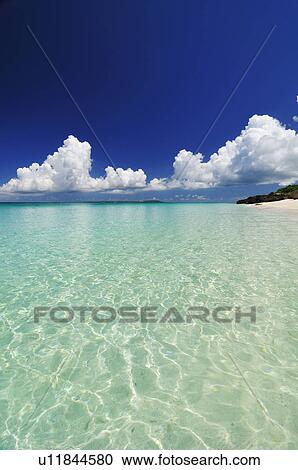 Stock Image - Cumulus Clouds Over Sea. Fotosearch