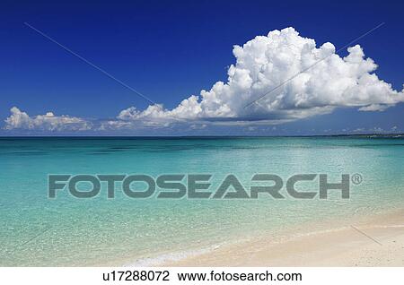 Stock Image - Cumulus Clouds Over Sea. Fotosearch